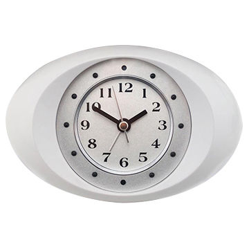 A wall-mounted digital clock with a white frame and a black analog face.